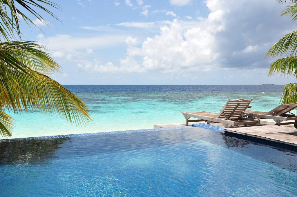 Swimming pool by the beach in the Maldives