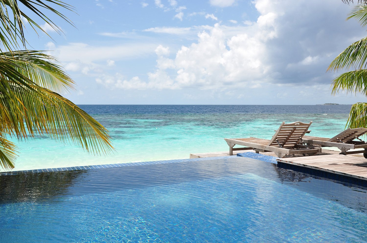 Swimming pool by the beach in the Maldives